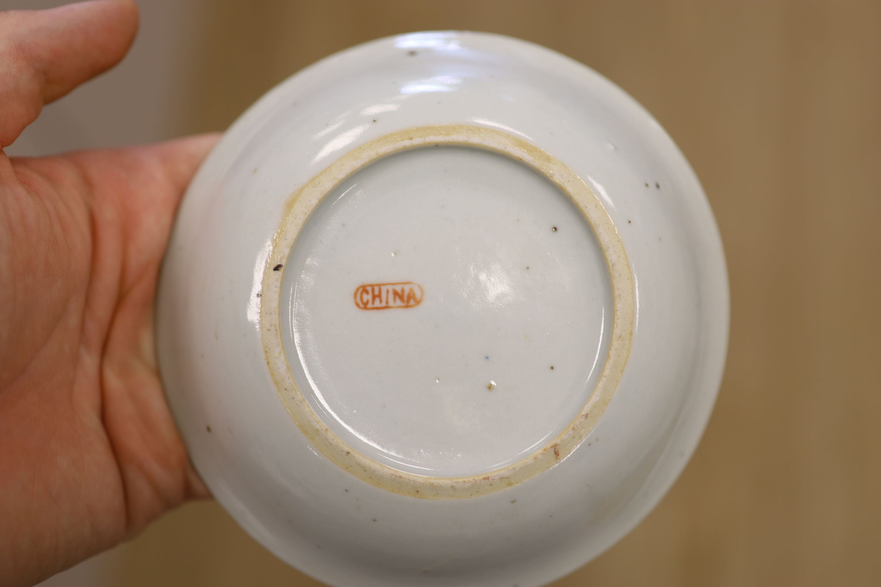 A Chinese famille rose box and cover, two vases, a sugar bowl and cover and a saucer, late 19th/early 20th century, tallest 19cm